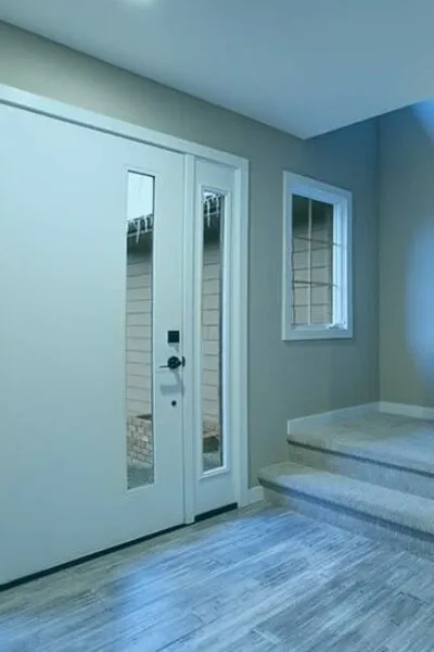 UPVC entry door with sidelight installed by Deluxe Windows